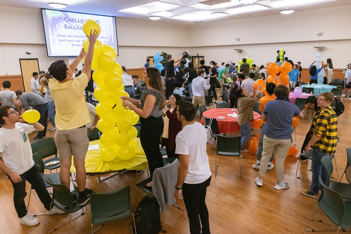 Accounting Color Wars - Hosted by Alpha Kappa Psi is a team-building event which representatives from accounting firms networked with School of Management students while participating in a variety of activities, such as building towers out of balloons, September 12, 2022 in the Mandela Room at the University Union.
